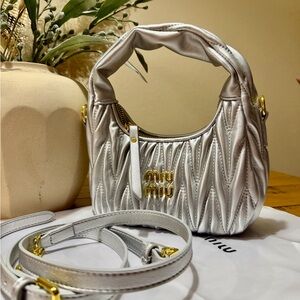 Miu Miu Metallic Silver Mini Bag with Gold Accents.